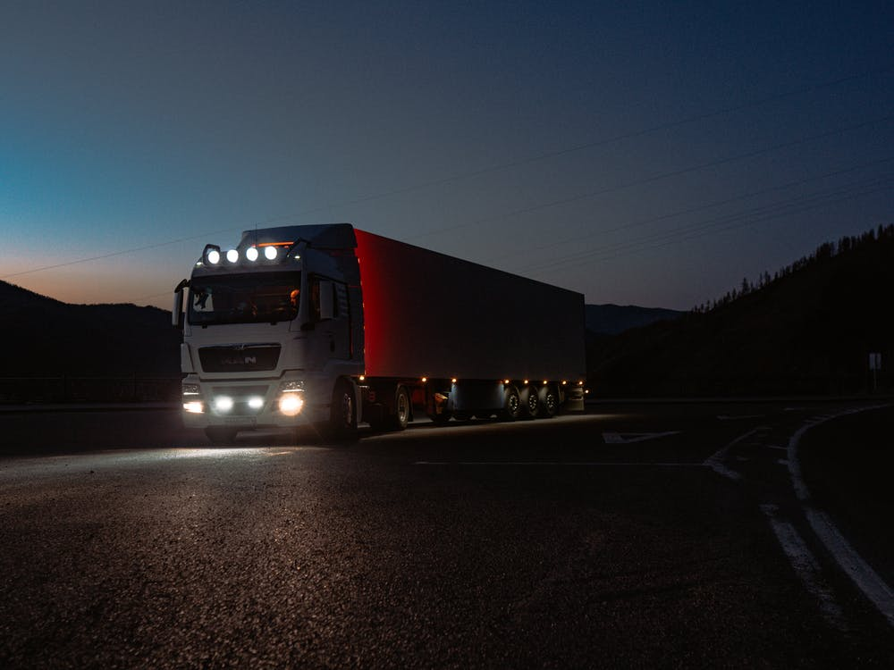 a truck on the road in the night